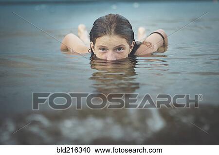 Caucasian girl swimming View Large Photo Image Stock Image - Caucasian girl swimming. Fotosearch