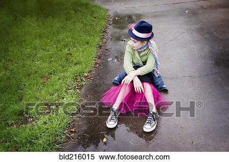 Caucasian girl wearing sneakers and tutu in puddle View Large Photo Image Stock Photography - Caucasian girl wearing sneakers and tutu in puddle. Fotosearch