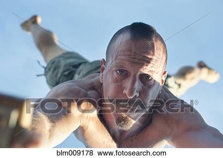 Caucasian man doing handstand View Large Photo Image Stock Photo - Caucasian man doing handstand. Fotosearch