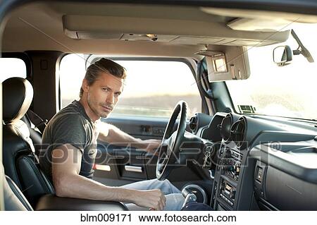 Caucasian man getting into truck View Large Photo Image Stock Image - Caucasian man getting into truck. Fotosearch