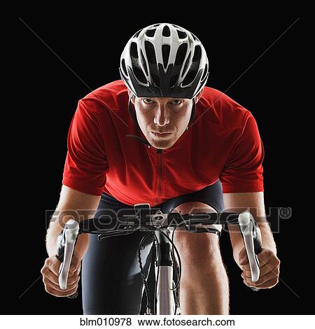 Caucasian man riding bicycle View Large Photo Image Stock Photo - Caucasian man riding bicycle. Fotosearch
