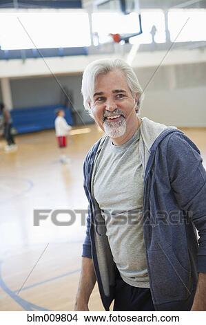 Caucasian man standing in gym View Large Photo Image Picture - Caucasian man standing in gym. Fotosearch
