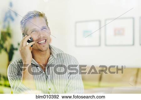 Caucasian man talking on cell phone View Large Photo Image Stock Image - Caucasian man talking on cell phone. Fotosearch