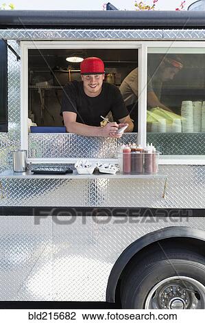 Caucasian man working in food truck View Large Photo Image Stock Image - Caucasian man working in food truck. Fotosearch