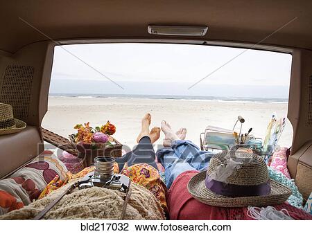 Caucasian mother and daughter relaxing in car View Large Photo Image Stock Image - Caucasian mother and daughter relaxing in car. Fotosearch