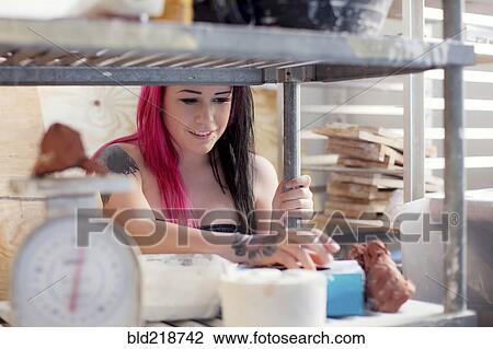 Stock Image - Caucasian sous chef cooking in kitchen. Fotosearch
