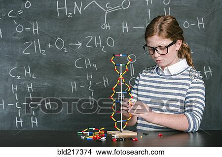 Caucasian student examining molecular model in science class View Large Photo Image Picture - Caucasian student examining molecular model in science class. Fotosearch
