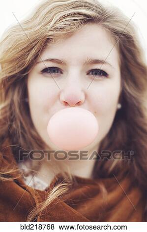 Caucasian teenage girl blowing bubble gum bubble View Large Photo Image Stock Photo - Caucasian teenage girl blowing bubble gum bubble. Fotosearch