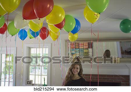 Caucasian teenage girl smiling at party View Large Photo Image Picture - Caucasian teenage girl smiling at party. Fotosearch