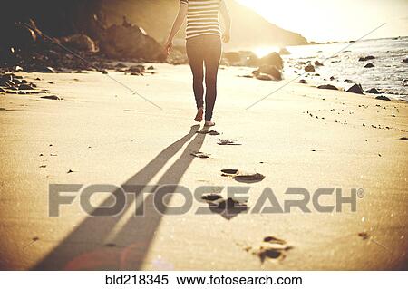 Caucasian teenage girl walking on beach View Large Photo Image Stock Photography - Caucasian teenage girl walking on beach. Fotosearch