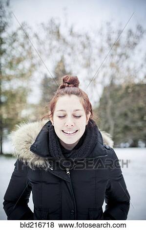 Stock Photo - Caucasian teenage girl wearing parka outdoors. Fotosearch
