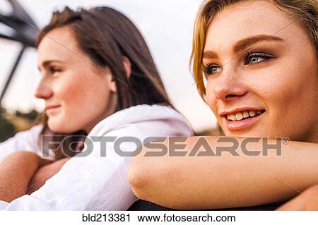 Caucasian teenage girls leaning on banister together View Large Photo Image Stock Image - Caucasian teenage girls leaning on banister together. Fotosearch