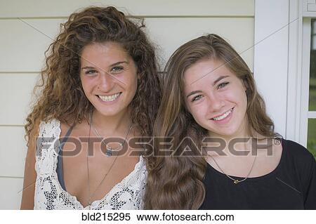 Caucasian teenage girls smiling outdoors View Large Photo Image Stock Photography - Caucasian teenage girls smiling outdoors. Fotosearch