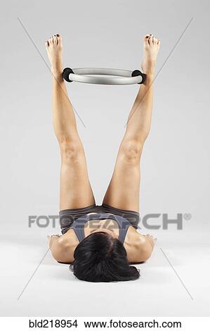 Caucasian woman exercising with resistance ring View Large Photo Image Picture - Caucasian woman exercising with resistance ring. Fotosearch