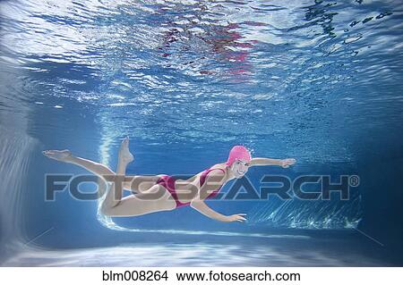 Caucasian woman in bikini swimming underwater View Large Photo Image Picture - Caucasian woman in bikini swimming underwater. Fotosearch
