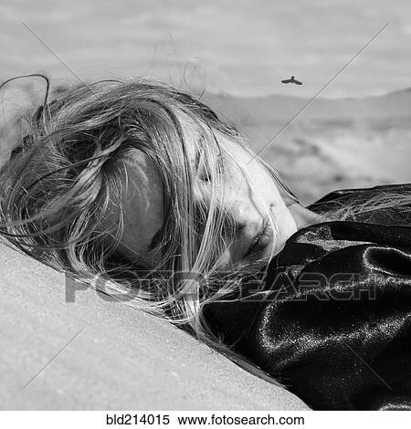 Caucasian woman laying outdoors View Large Photo Image Stock Photography - Caucasian woman laying outdoors. Fotosearch