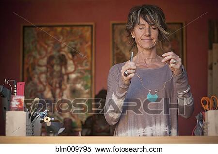 Caucasian woman making jewelry View Large Photo Image Stock Photography - Caucasian woman making jewelry. Fotosearch