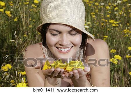Caucasian woman picking wildflowers in field View Large Photo Image Stock Image - Caucasian woman picking wildflowers in field. Fotosearch