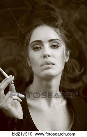 Caucasian woman smoking cigarette View Large Photo Image Stock Image - Caucasian woman smoking cigarette. Fotosearch