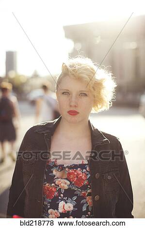 Caucasian woman standing in city View Large Photo Image Stock Photo - Caucasian woman standing in city. Fotosearch