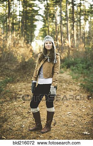 Caucasian woman standing in park View Large Photo Image Stock Image - Caucasian woman standing in park. Fotosearch
