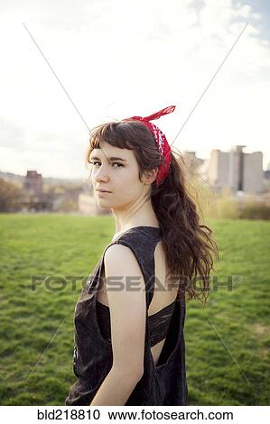 Caucasian woman standing in urban park View Large Photo Image Stock Image - Caucasian woman standing in urban park. Fotosearch