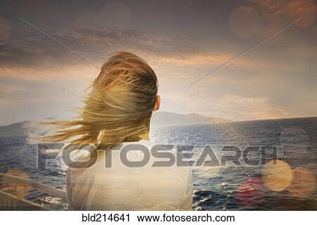 Caucasian woman standing on boat admiring ocean View Large Photo Image Stock Image - Caucasian woman standing on boat admiring ocean. Fotosearch