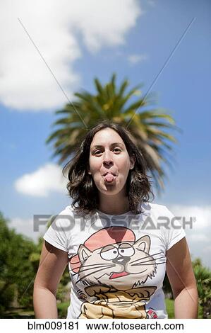 Caucasian woman sticking out tongue View Large Photo Image Stock Image - Caucasian woman sticking out tongue. Fotosearch