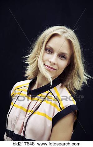 Stock Photo - Caucasian woman tossing her hair. Fotosearch