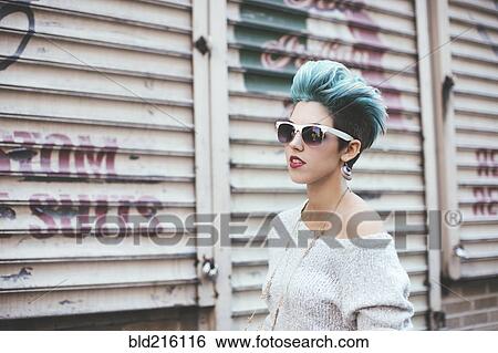 Stock Photograph - Caucasian woman walking at warehouse. Fotosearch