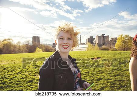 Stock Photography - Caucasian woman walking in urban park. Fotosearch