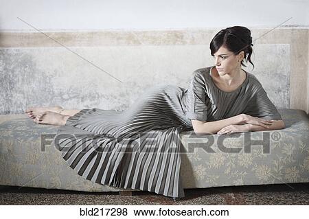 Stock Photo - Caucasian woman wearing evening gown. Fotosearch
