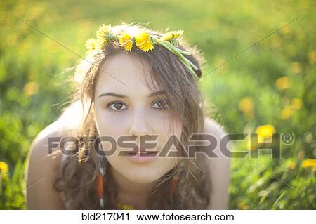 Caucasian woman wearing flowers in her hair View Large Photo Image Stock Image - Caucasian woman wearing flowers in her hair. Fotosearch