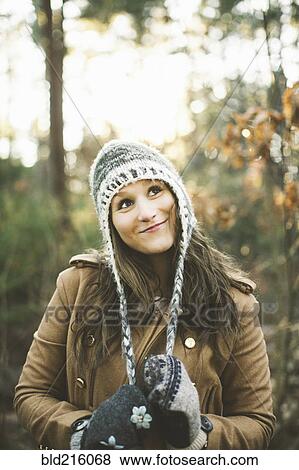 Caucasian woman wearing knitted cap in park View Large Photo Image Stock Photo - Caucasian woman wearing knitted cap in park. Fotosearch