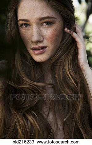 Caucasian woman with long hair and freckles View Large Photo Image Stock Image - Caucasian woman with long hair and freckles. Fotosearch