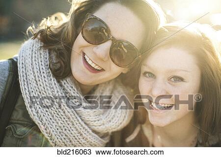 Caucasian women smiling outdoors View Large Photo Image Stock Image - Caucasian women smiling outdoors. Fotosearch