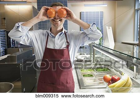 Caucasian worker playing with fruit in cafe View Large Photo Image Stock Photography - Caucasian worker playing with fruit in cafe. Fotosearch