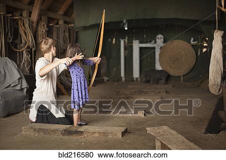 Children practicing archery with target View Large Photo Image Stock Image - Children practicing archery with target. Fotosearch