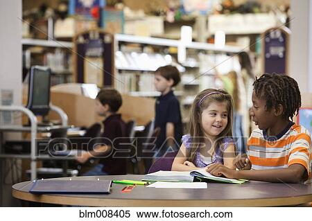 Children reading book together in library View Large Photo Image Stock Photography - Children reading book together in library. Fotosearch