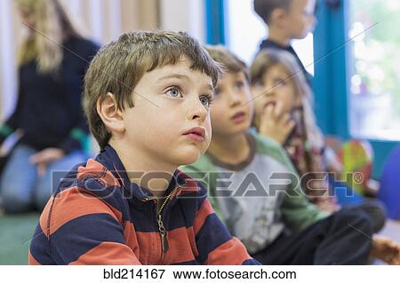 Children sitting and listening in classroom View Large Photo Image Stock Photo - Children sitting and listening in classroom. Fotosearch