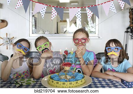 Picture - Children wearing disguises at birthday party. Fotosearch