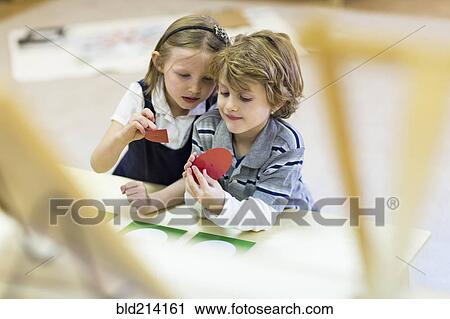 Children working together in classroom View Large Photo Image Stock Image - Children working together in classroom. Fotosearch
