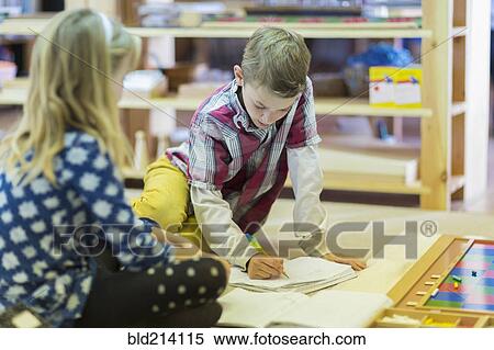Children writing in classroom View Large Photo Image Stock Photography - Children writing in classroom. Fotosearch