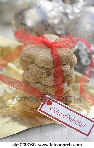 Christmas cookies tied with red ribbon View Large Photo Image Stock Photo - Christmas cookies tied with red ribbon. Fotosearch