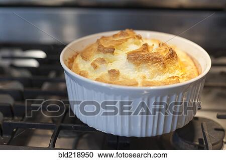 Stock Image - Close up of baked souffle on stove. Fotosearch