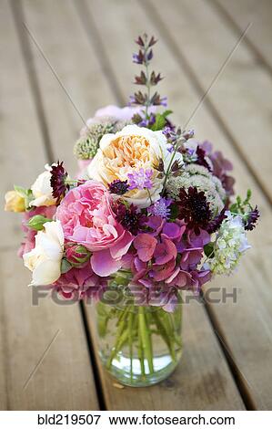 Stock Photo - Close up of bouquet of flowers in glass vase. Fotosearch