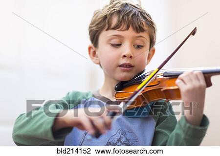 Close up of boy playing violin View Large Photo Image Stock Image - Close up of boy playing violin. Fotosearch