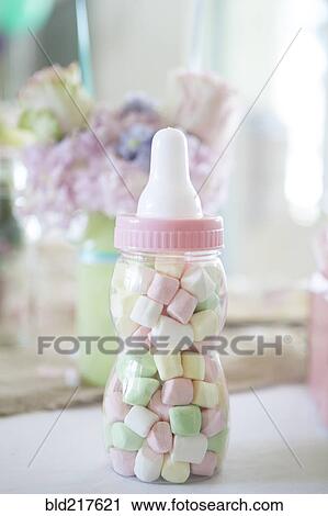 Stock Image - Close up of candy baby bottle gift. Fotosearch