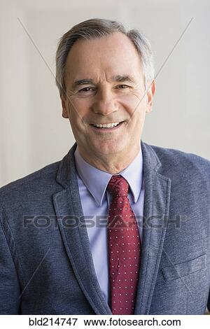 Close up of Caucasian businessman smiling View Large Photo Image Stock Photo - Close up of Caucasian businessman smiling. Fotosearch