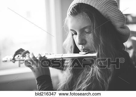 Close up of Caucasian girl playing flute View Large Photo Image Stock Photo - Close up of Caucasian girl playing flute. Fotosearch